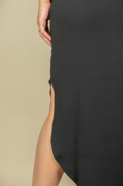 Close-up of the side slit detail on a black dress showcasing the plus size batwing sleeve long dress features.