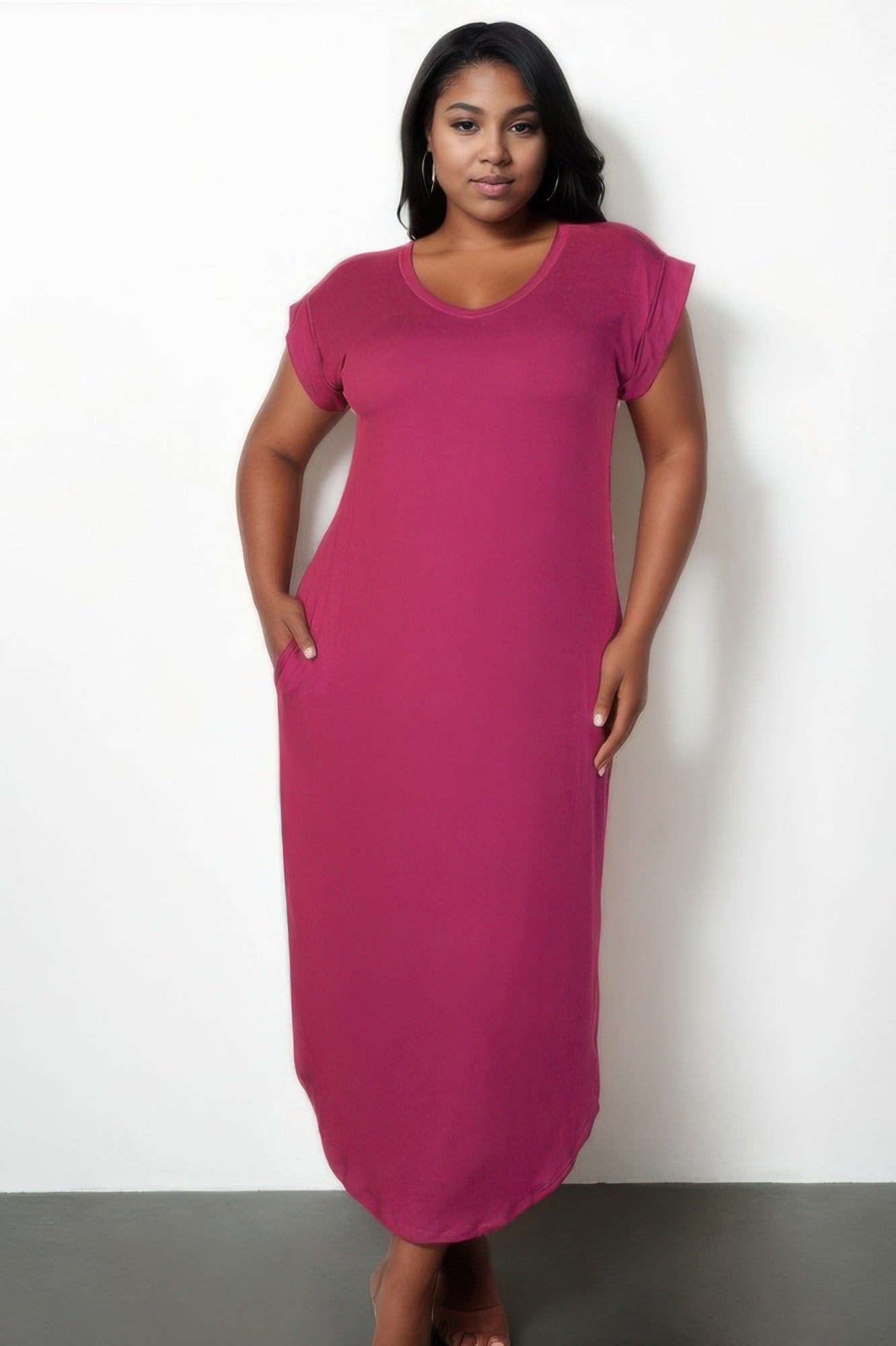 Plus size batwing sleeve long dress in vibrant pink with hidden pockets and a flowing silhouette.