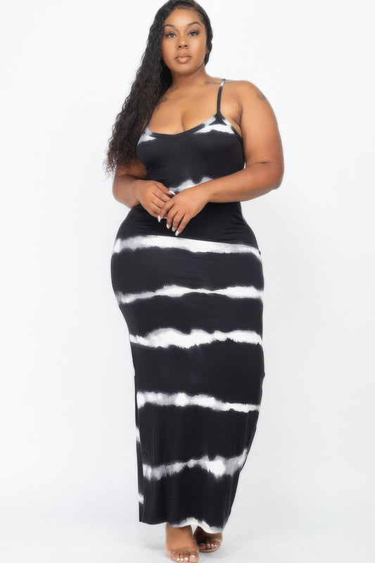 plus size striped maxi dress featuring fixed spaghetti straps and a flowing design in black and white.