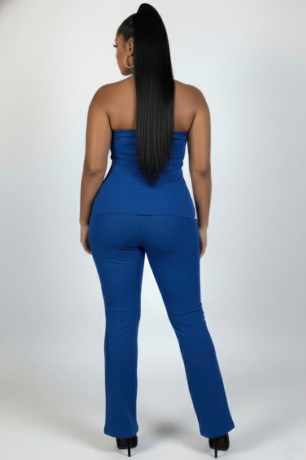 Back view of a model wearing the Plus Size Ultra-Fine Ribbed Slit Tube Top and Flare Pants Set in blue.