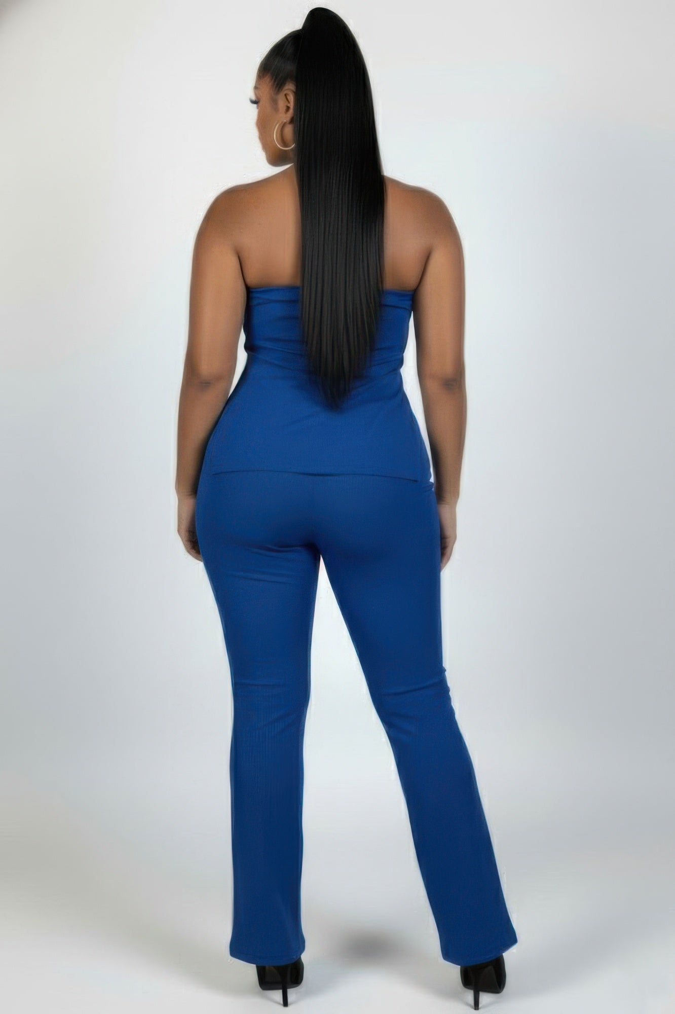 Back view of a model wearing the Plus Size Ultra-Fine Ribbed Slit Tube Top and Flare Pants Set in blue.