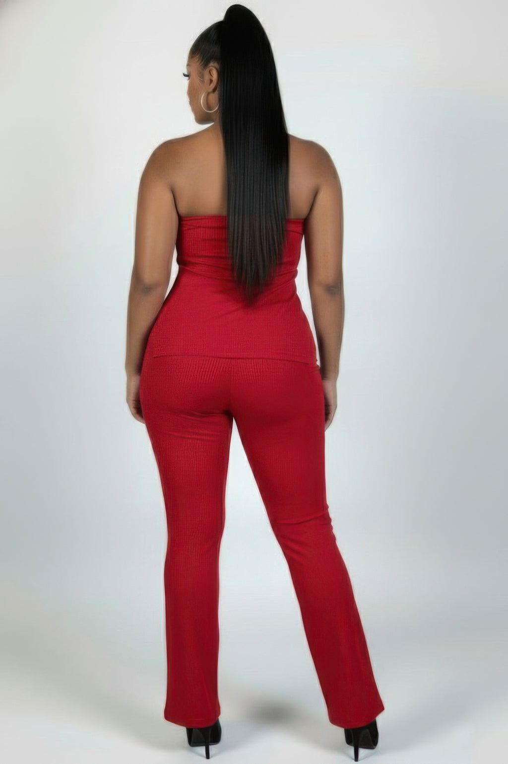 Plus size ribbed tube top and flare pants set displayed in red from the back, showcasing a stylish side slit and fitted design.