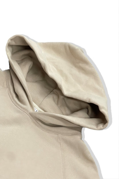Close-up of the hood of a premium cotton blend hoodie set showcasing soft beige fabric and oversized design.