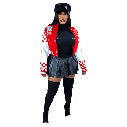 Urban street style jacket worn with a black top and leather skirt, complementing a bold street-inspired look.