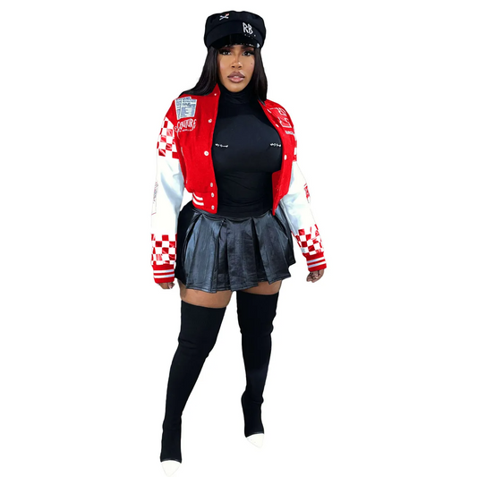 Urban street style jacket worn with a black top and leather skirt, complementing a bold street-inspired look.
