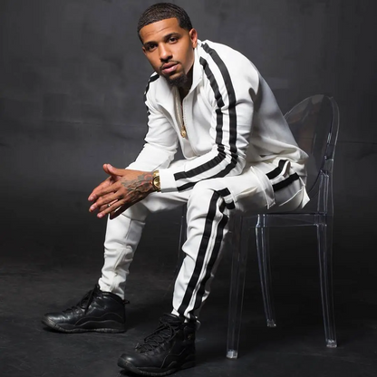 Men's striped jogger set featuring a zip-front track jacket and tapered jogger pants with contrast side stripes.