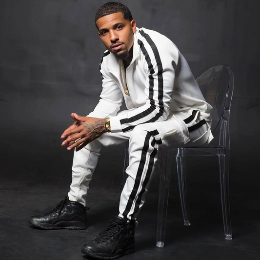 Men's striped jogger set featuring a zip-front track jacket and tapered jogger pants with contrast side stripes.