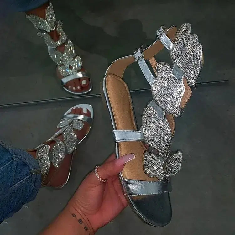 Crystal Butterfly Ankle-Strap Gladiator Sandals featuring shimmering butterfly accents and an open-toe design.