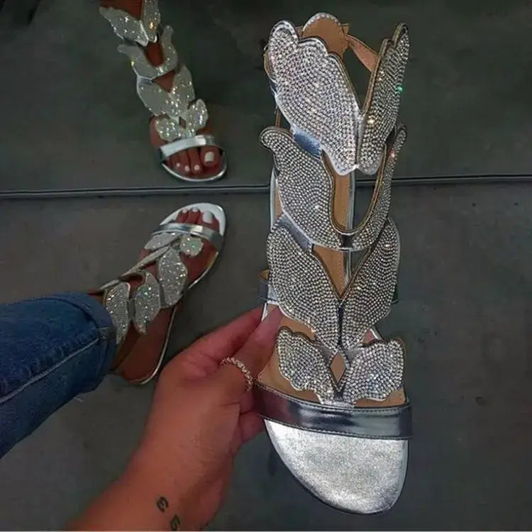 Crystal Butterfly Ankle-Strap Gladiator Sandals featuring shimmering butterfly accents and a stylish open-toe design.