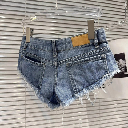 Distressed Raw-Hem Low-Rise Denim Shorts showcasing the frayed hem and fitted low-rise design from the back.