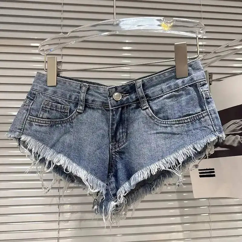 Distressed Raw-Hem Low-Rise Denim Shorts featuring a frayed hem and classic button-and-zip front design.