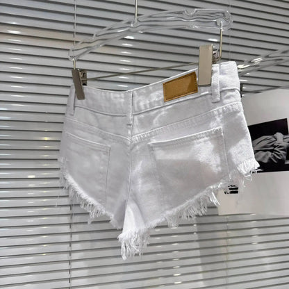 Distressed Raw-Hem Low-Rise Denim Shorts showcased in white with a frayed hem and fitted low-rise waist.
