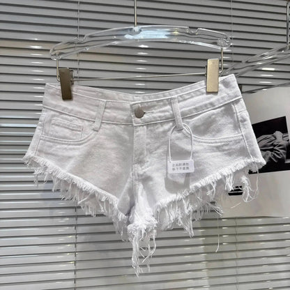 Distressed Raw-Hem Low-Rise Denim Shorts displayed on a hanger, featuring a frayed hem and fitted low-rise waist.
