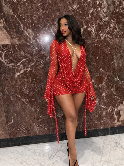 Draped Cowl Neck Printed Backless Mini Dress in red with polka dots, featuring a plunging neckline and batwing sleeves.