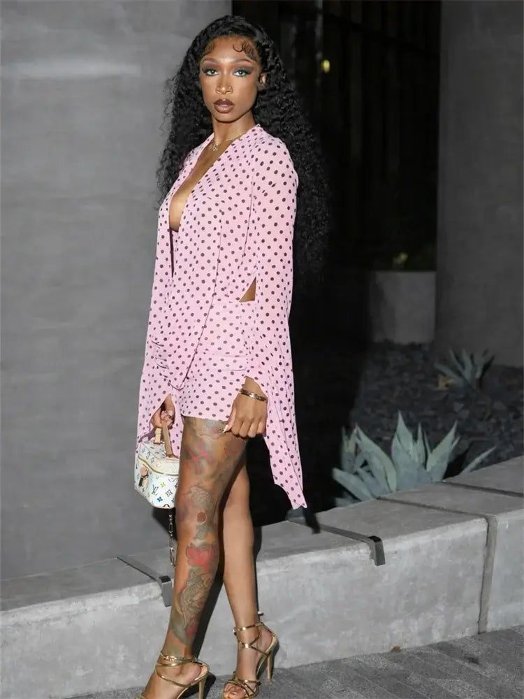 Draped Cowl Neck Printed Backless Mini Dress featuring pink polka dots and stylish side cutouts.