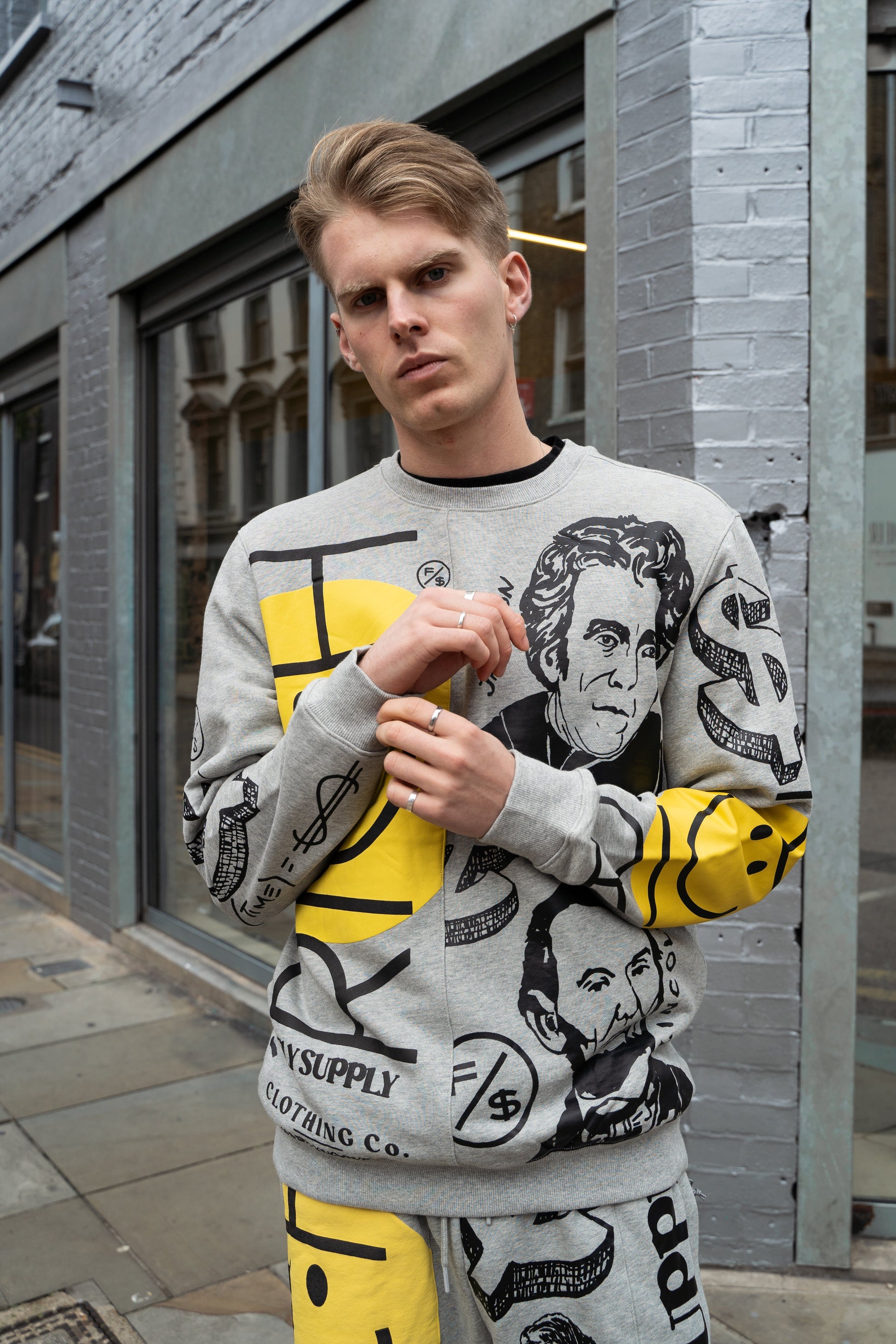 Graphic Statement Shorts worn with matching graphic sweater in bold streetwear print.