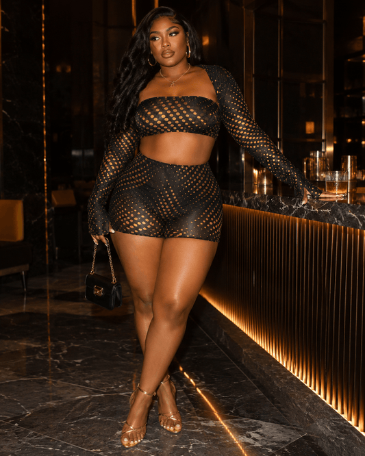 Gold Polka Dot Mesh 3-Piece Crop Top & Shorts Set featuring a stylish model in a chic bar setting.