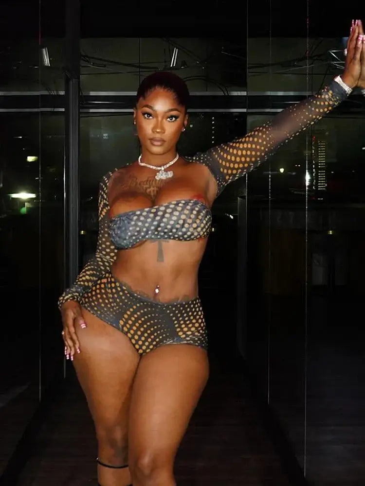 Model showcasing the Gold Polka Dot Mesh 3-Piece Crop Top & Shorts Set in a chic setting.