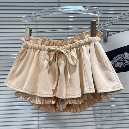 Layered Ruffle Drawstring Mini Skort displayed on a hanger, showcasing its layered ruffles and adjustable drawstring.