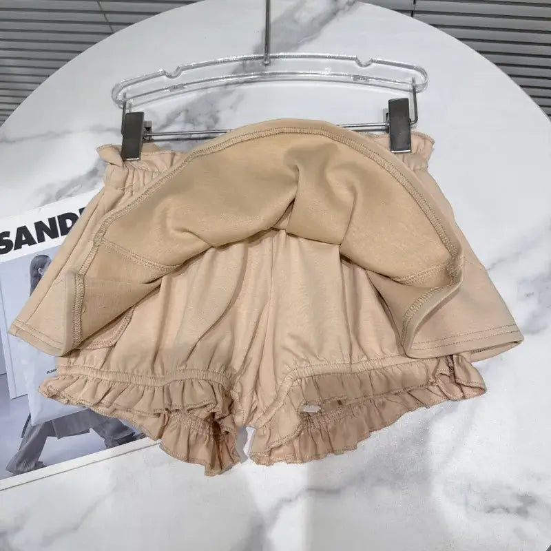 Layered Ruffle Drawstring Mini Skort displayed from the back, showcasing ruffled hem and elastic waistband.