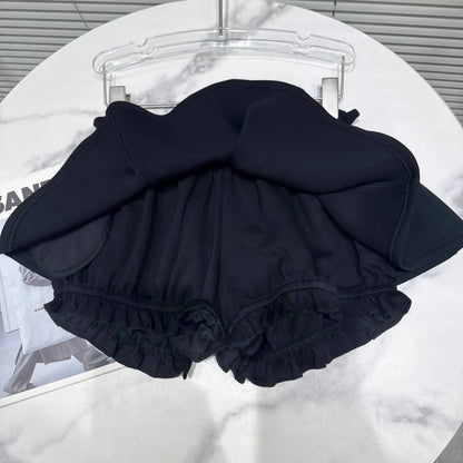 Layered Ruffle Drawstring Mini Skort showing the ruffled layer and shorts-style underlayer in black.