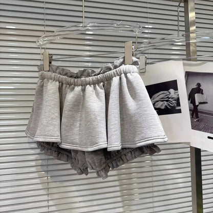 Layered Ruffle Drawstring Mini Skort displayed on a hanger, showcasing its ruffled design and elastic waistband.
