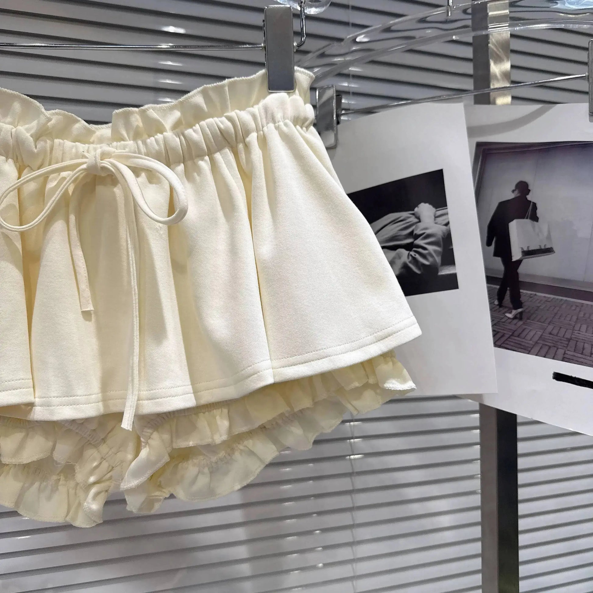 Layered Ruffle Drawstring Mini Skort in cream color showcasing the ruffle layers and adjustable drawstring.