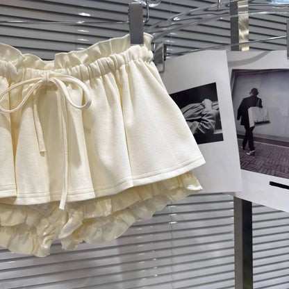 Layered Ruffle Drawstring Mini Skort in cream color showcasing the ruffle layers and adjustable drawstring.
