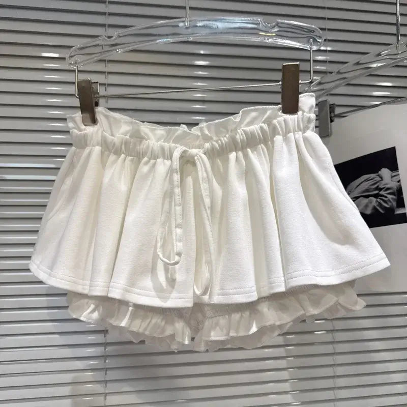 Layered Ruffle Drawstring Mini Skort displayed on a hanger, showcasing its playful layered design and elastic waistband.