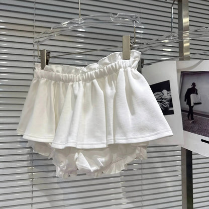 Layered Ruffle Drawstring Mini Skort displayed on a hanger showing white layered ruffles and shorts underneath.