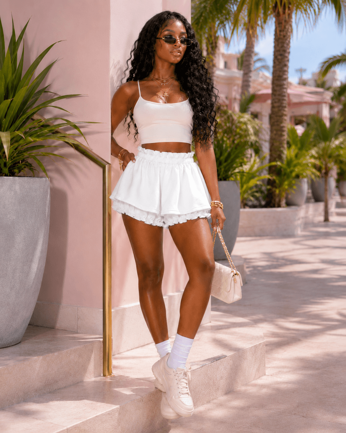 Layered Ruffle Drawstring Mini Skort in white, featuring a playful ruffled design and elastic drawstring waistband.