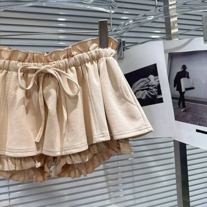 Layered Ruffle Drawstring Mini Skort showcasing a playful, feminine design with ruffled layers and adjustable waistband.