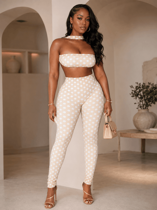 Retro polka dot crop top set featuring a strapless bandeau and high-waist leggings in a chic neutral tone.