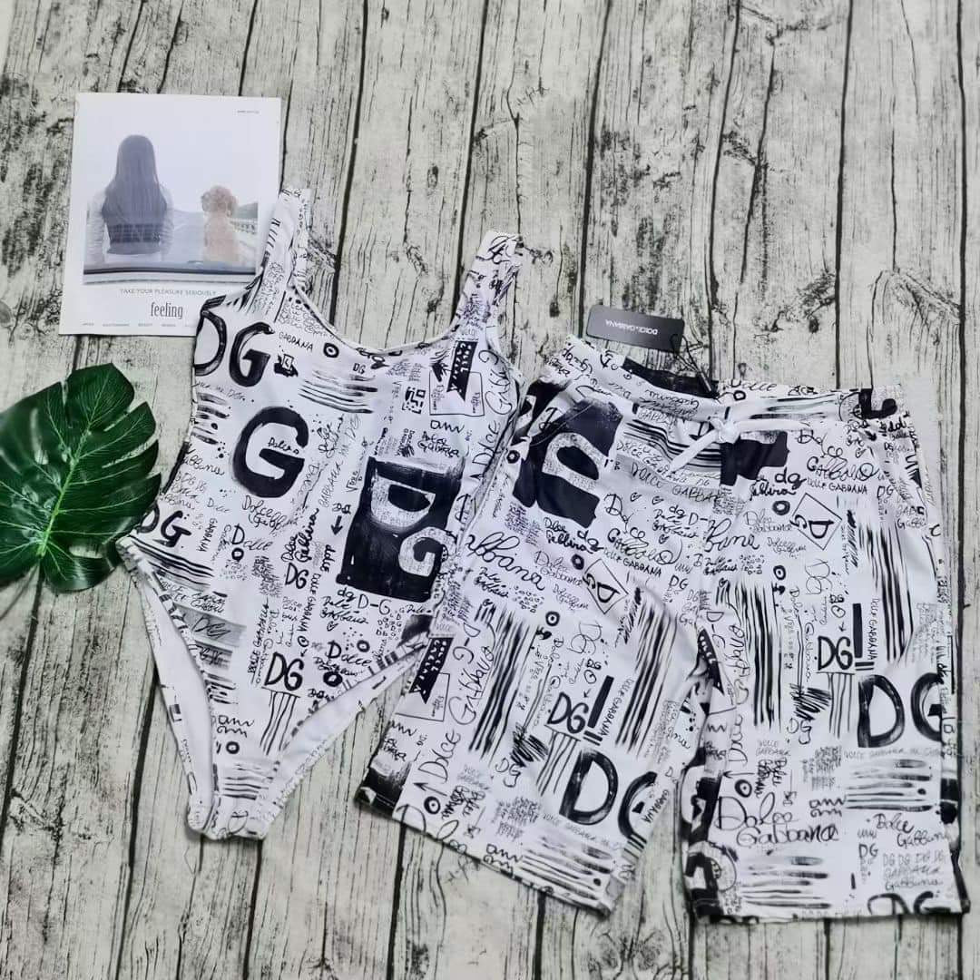 His and Her matching monogram swimwear set with bold prints for coordinated beach style.