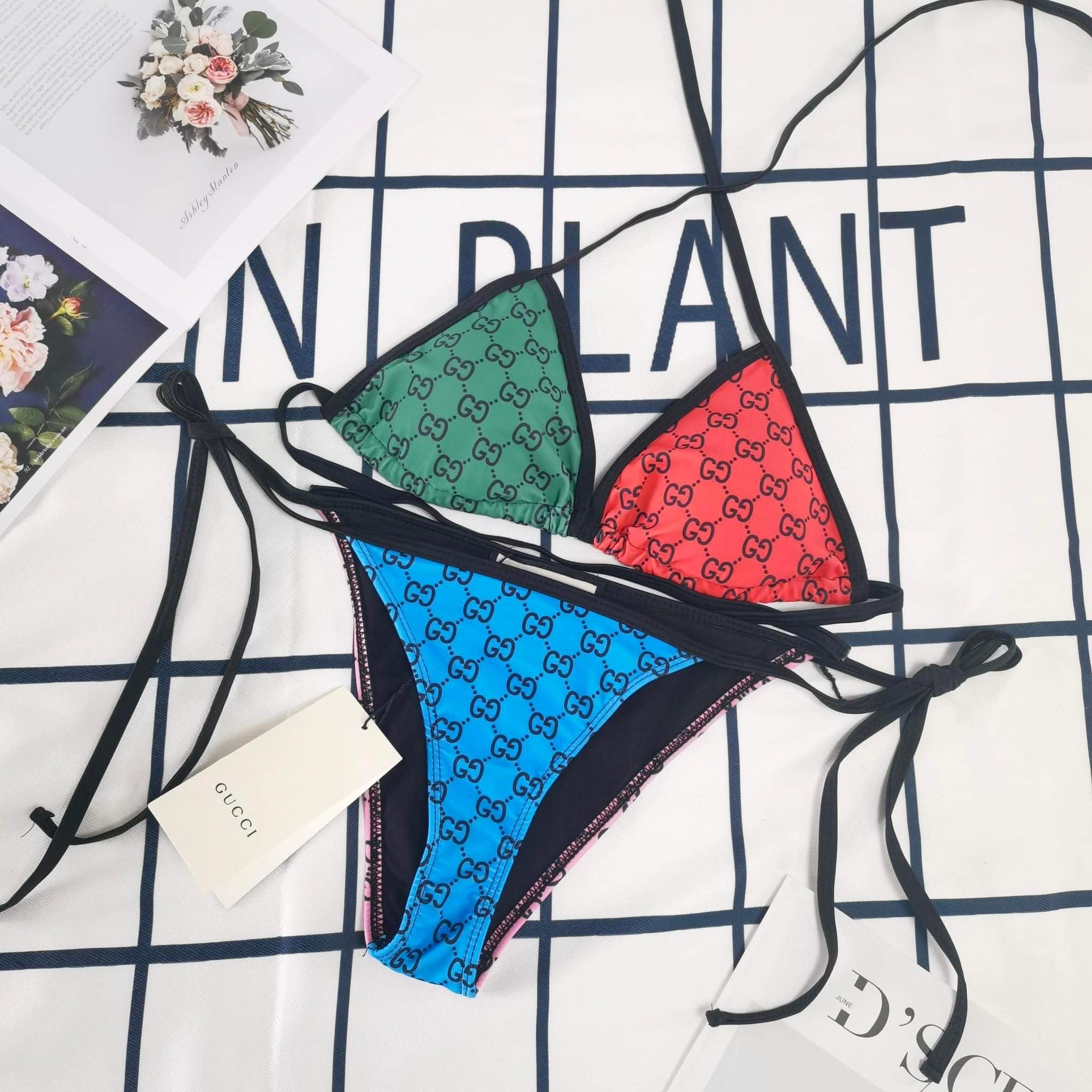 His and Her Matching Monogram Swimwear featuring bold multicolor prints and stylish design on a beach backdrop.