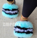 plush faux fur slides in blue and black design, featuring a cozy plush upper and stylish look.