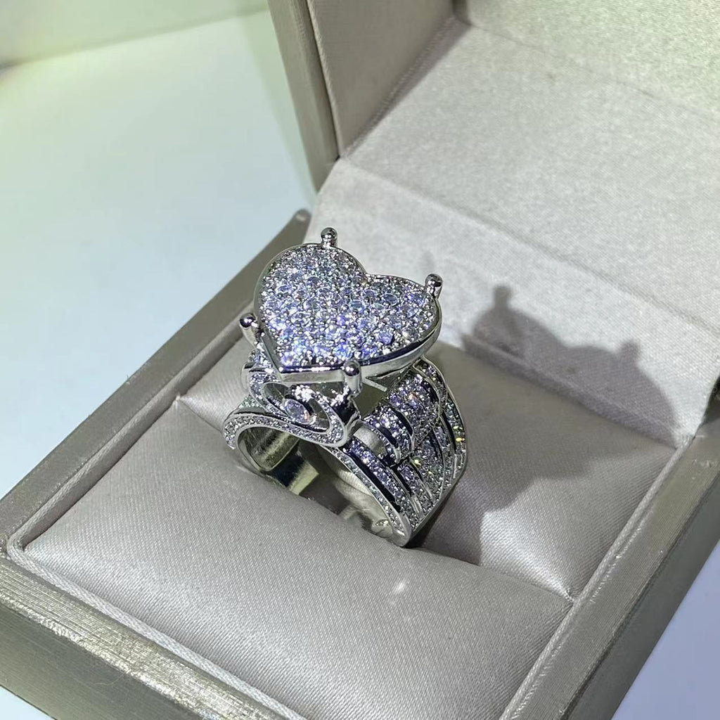 Heart-shaped zircon ring displayed in an elegant jewelry box, featuring a sparkling heart-shaped design.