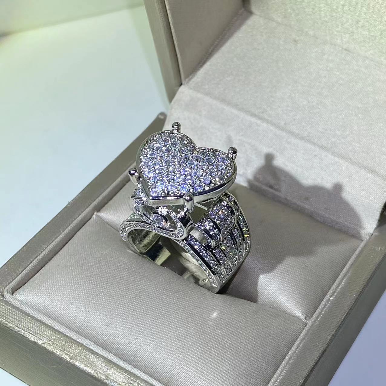 Heart-shaped zircon ring displayed in an elegant jewelry box, featuring a sparkling heart-shaped design.