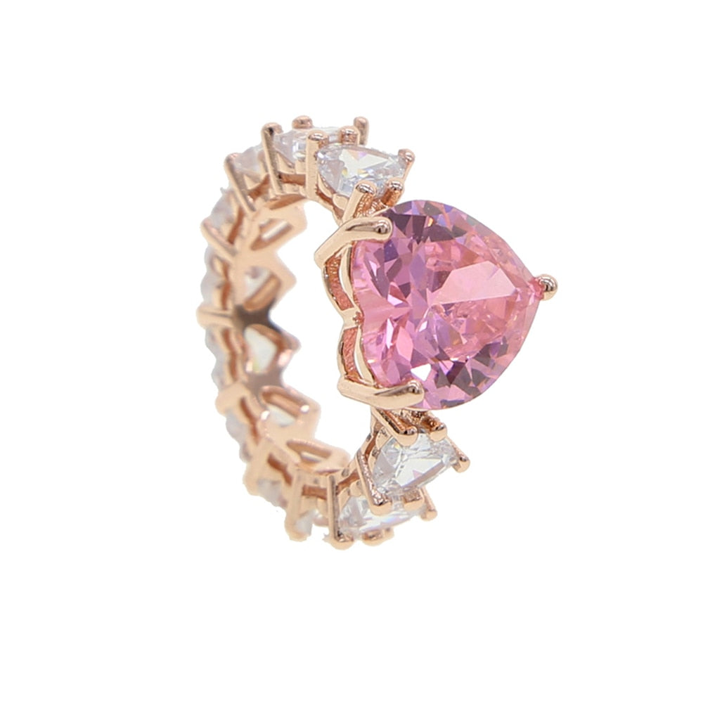 Cubic zirconia heart ring featuring a pink heart-shaped gemstone and prong setting in rose gold color.