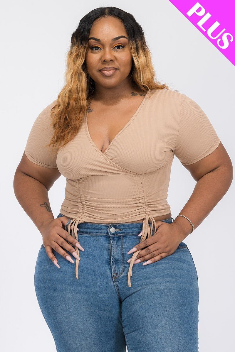 Wrap tie v-neck fitted shirt in beige with adjustable ties, perfect for accentuating curves.