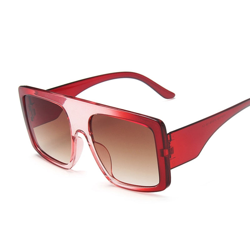 Fashion sunglasses with UV protection featuring red plastic frames and gradient lenses.